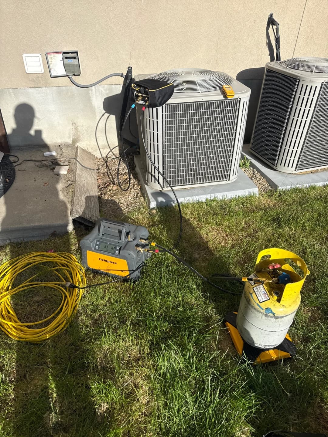Refrigerant service equipment connected to a condenser